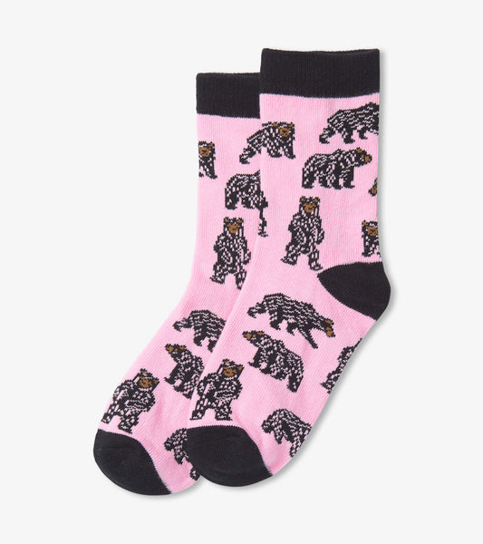 Pink crew socks featuring playful black bear patterns, with a contrasting black cuff and toe. Suitable for kids ages 2-7.