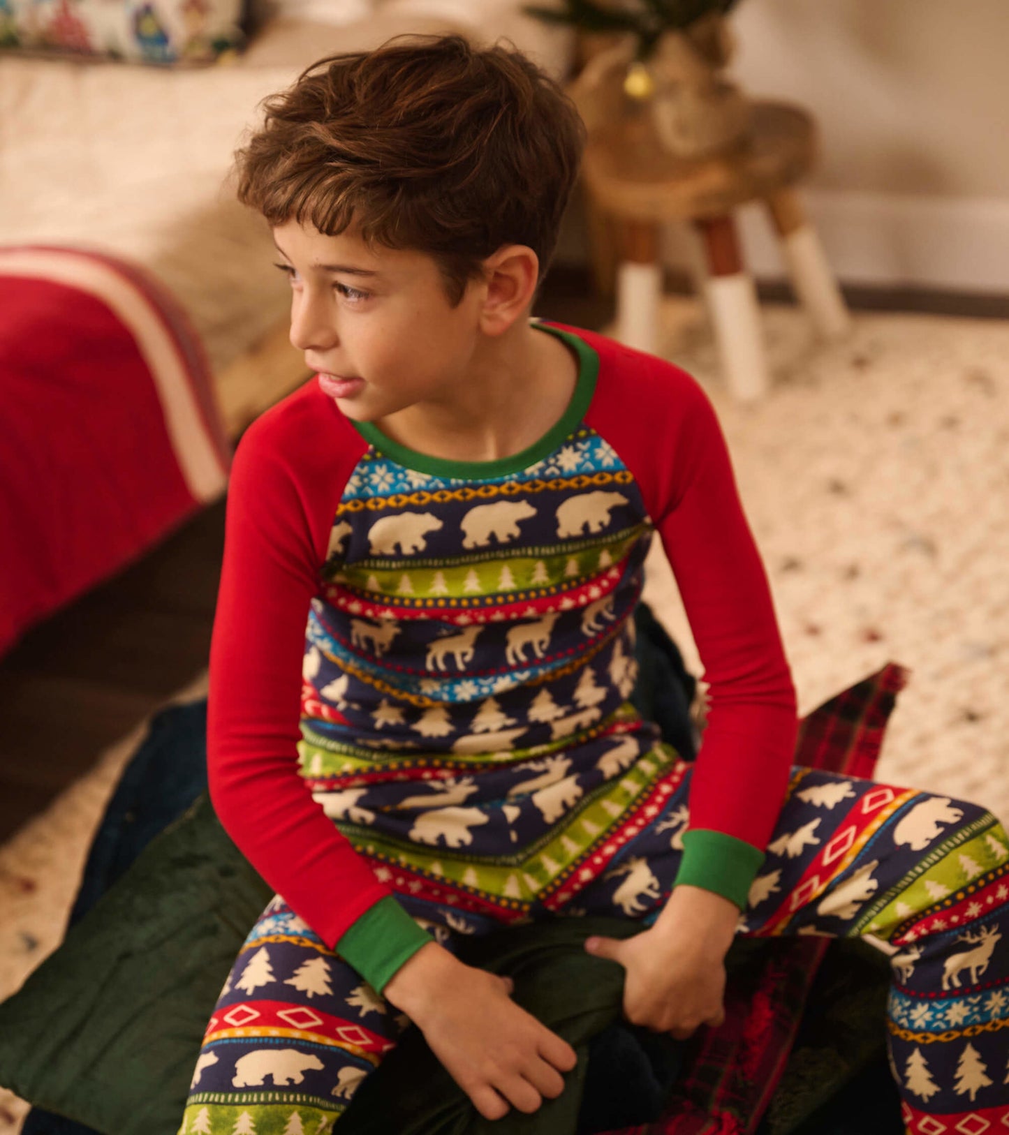 Navy and red organic cotton pajama set with Fairisle pattern featuring bears and trees, suitable for kids.