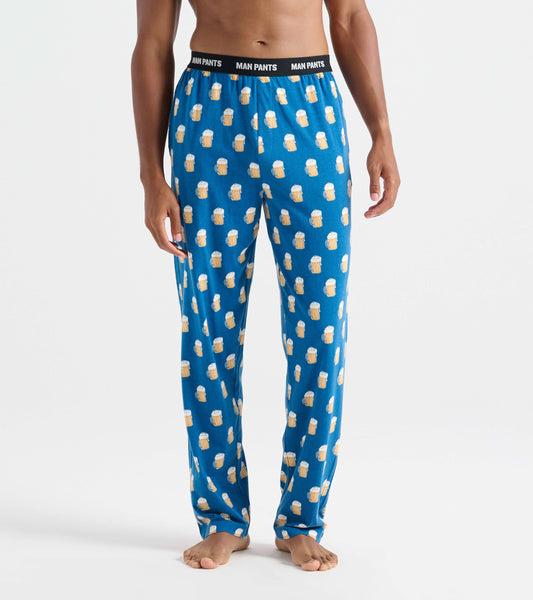 Blue pajama pants featuring a playful beer mug pattern, with an elastic waistband labeled "MAN PANTS.