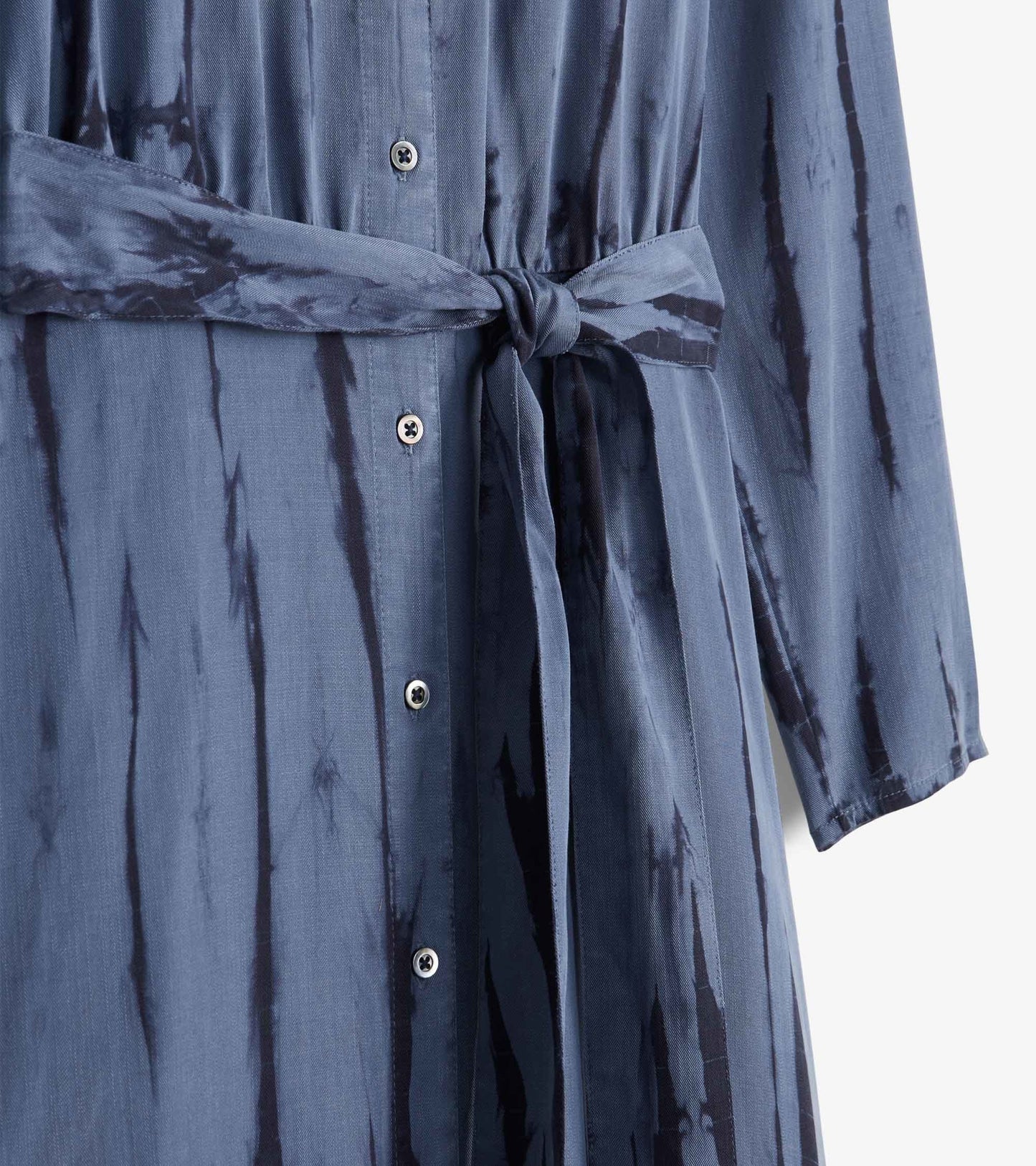 Maxi shirt dress in deep blue with a tie waist, featuring a button-down front and long sleeves, showcasing a subtle pattern.