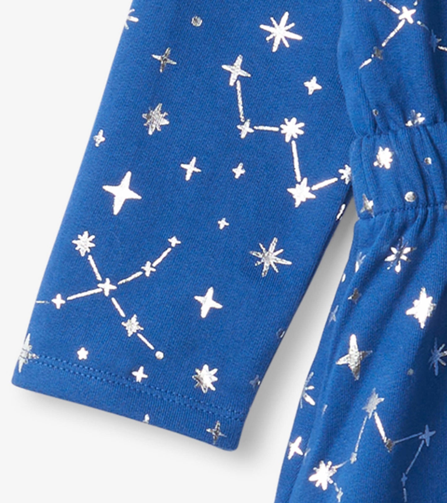 Blue terry dress featuring silver constellations and stars, with an elastic waistband for a comfortable fit.
