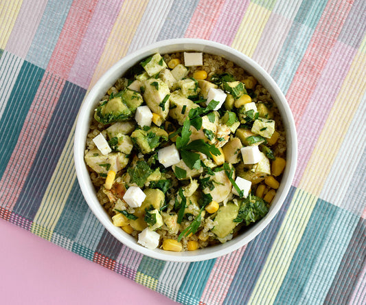 Quinoa bowl with chicken, avocado, feta and corn