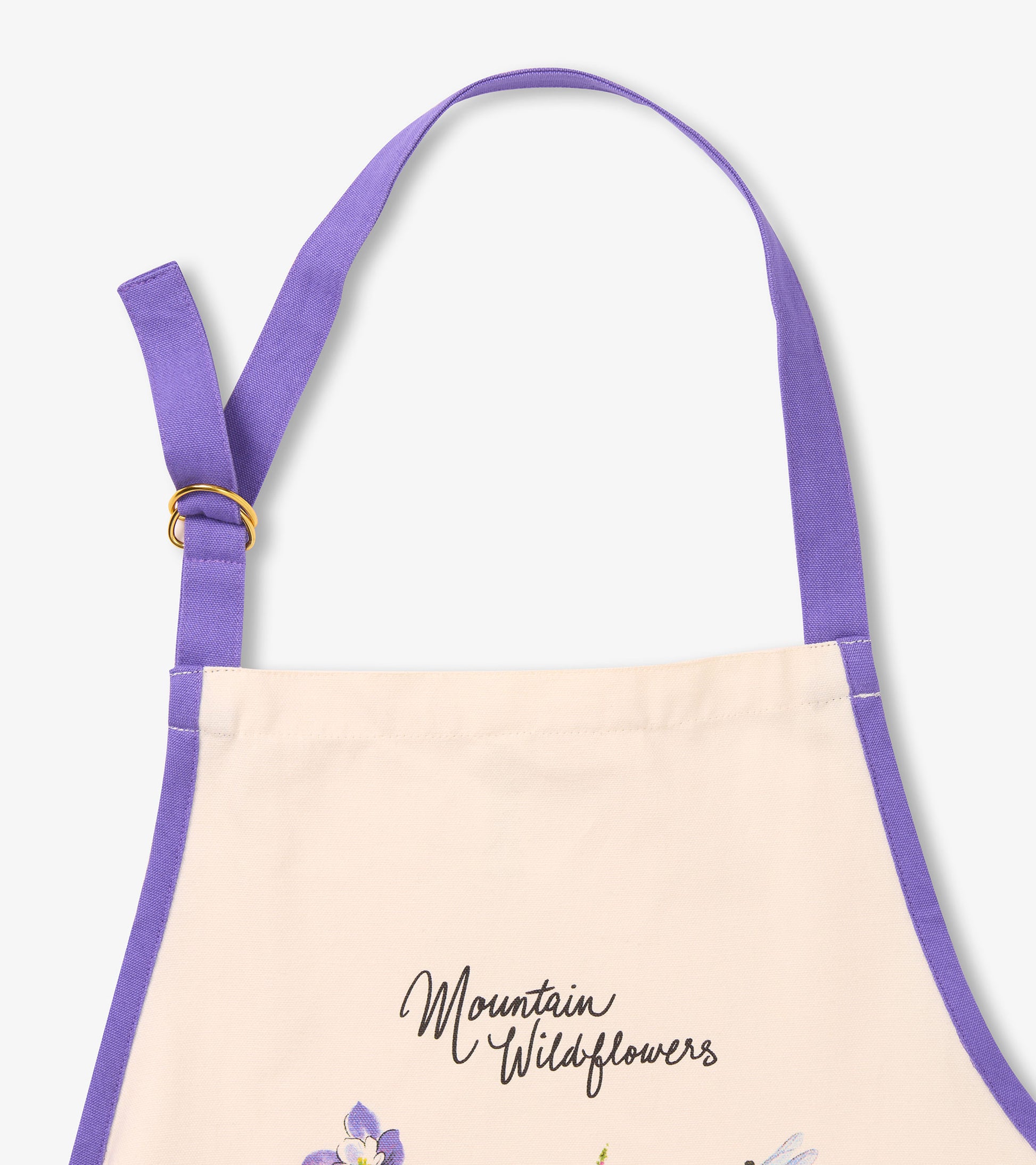 Cream apron with purple straps featuring a wildflower design and the text "Mountain Wildflowers.