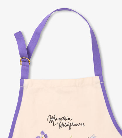 Cream apron with purple straps featuring a wildflower design and the text "Mountain Wildflowers.
