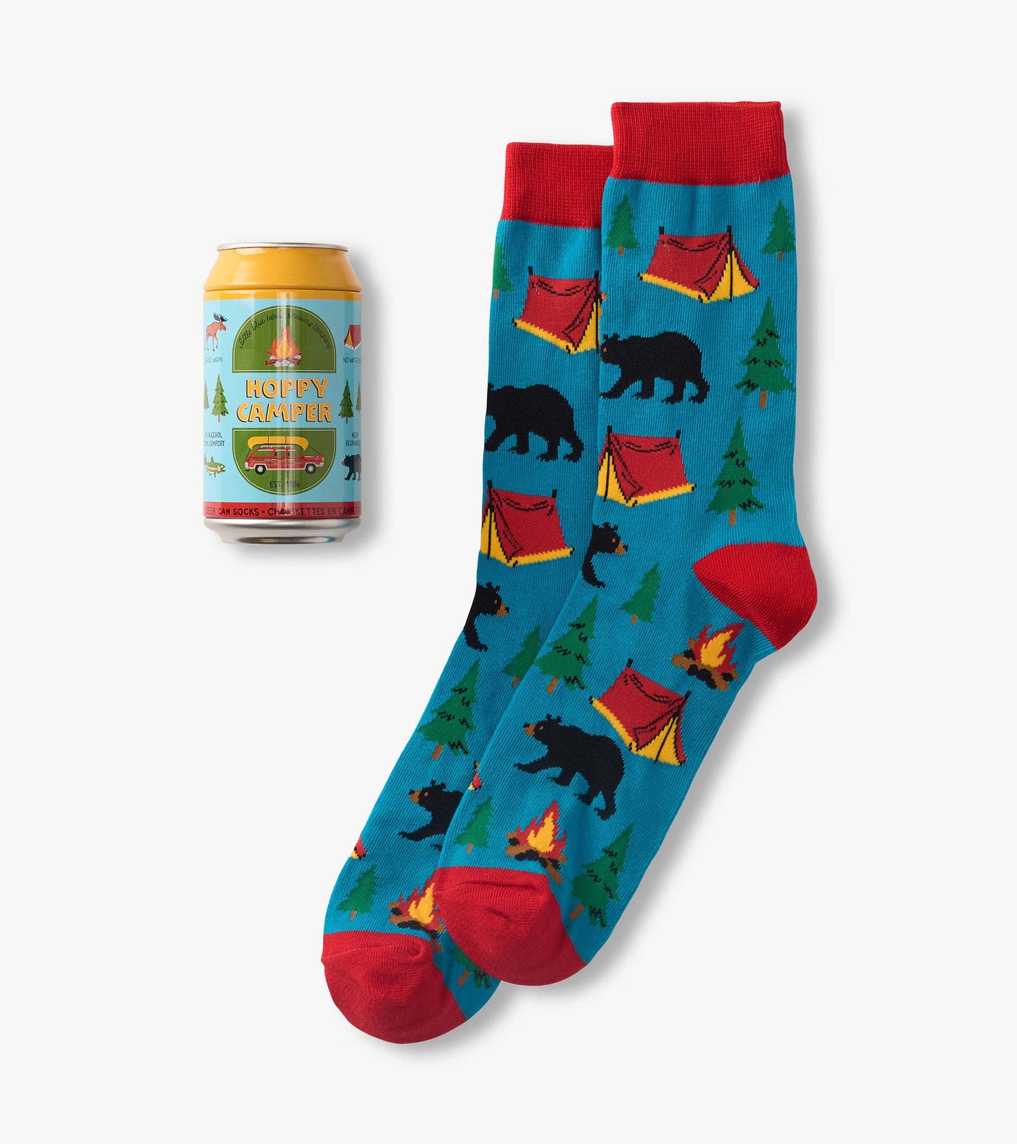 Blue crew socks with red cuffs and toes, featuring bears, tents, trees, and campfires, beside a beer can package