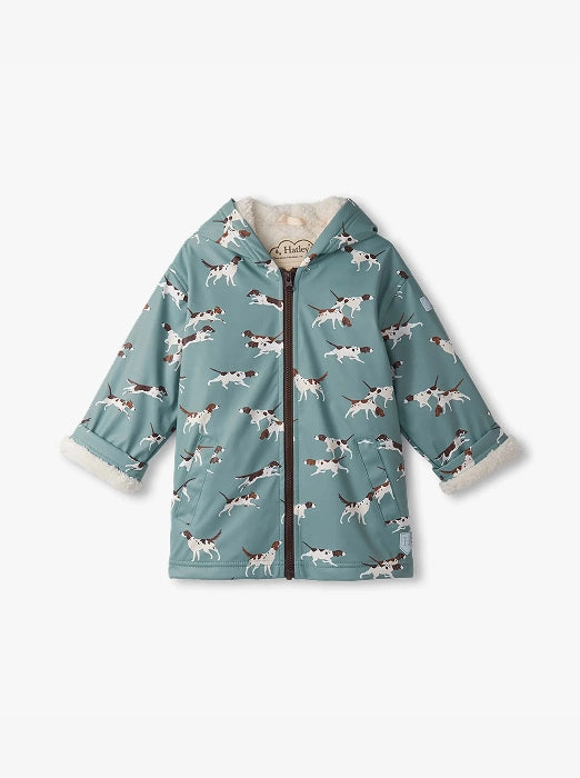 Promotes boys' sale rainwear. Showing blue hooded raincoat with dog print.