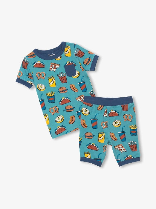 Promotes boys sleepwear sale collection. Showing blue short-sleeve pajama set with colorful food print.