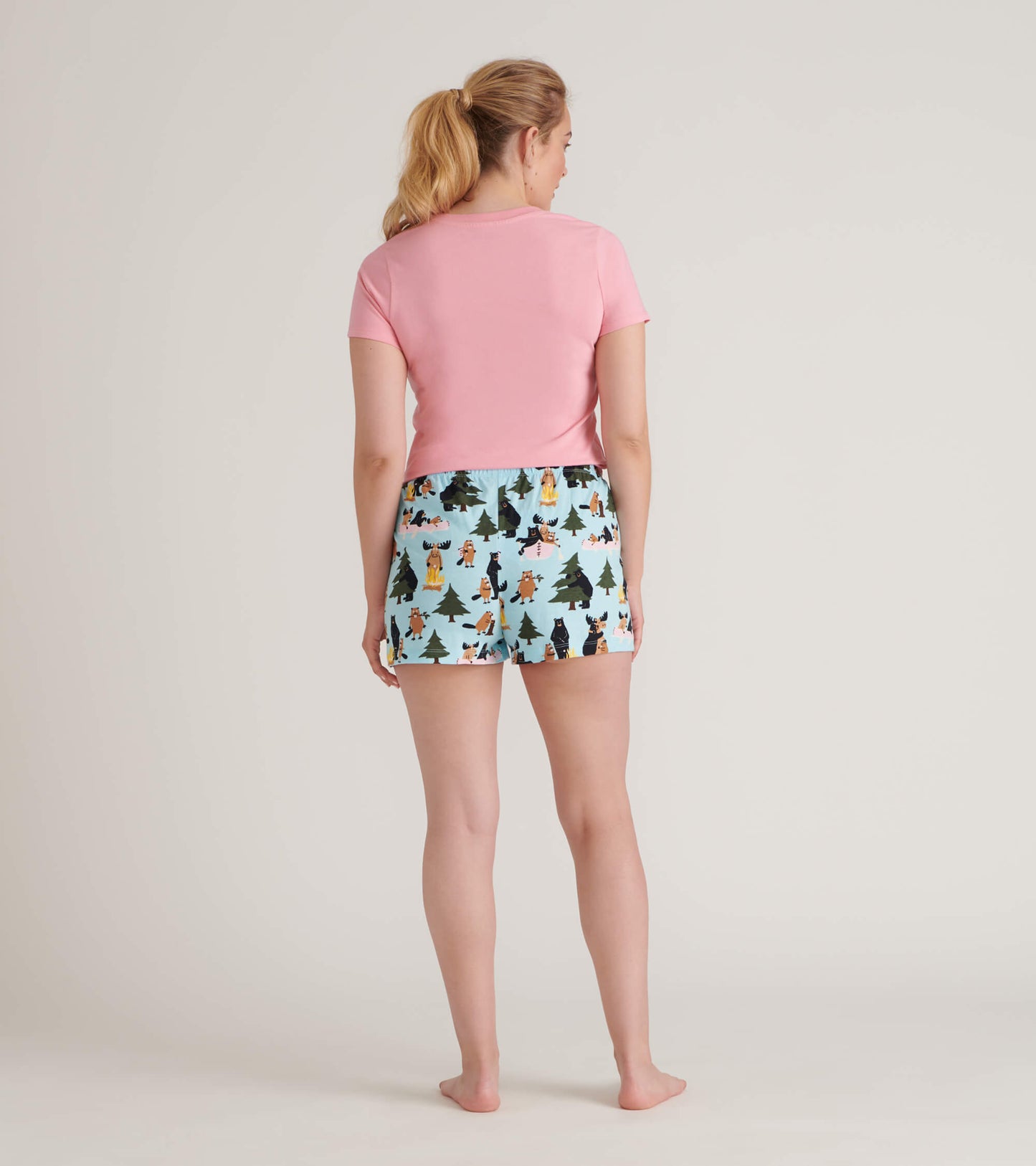 Back view of blue sleep shorts with woodland animal and tree print