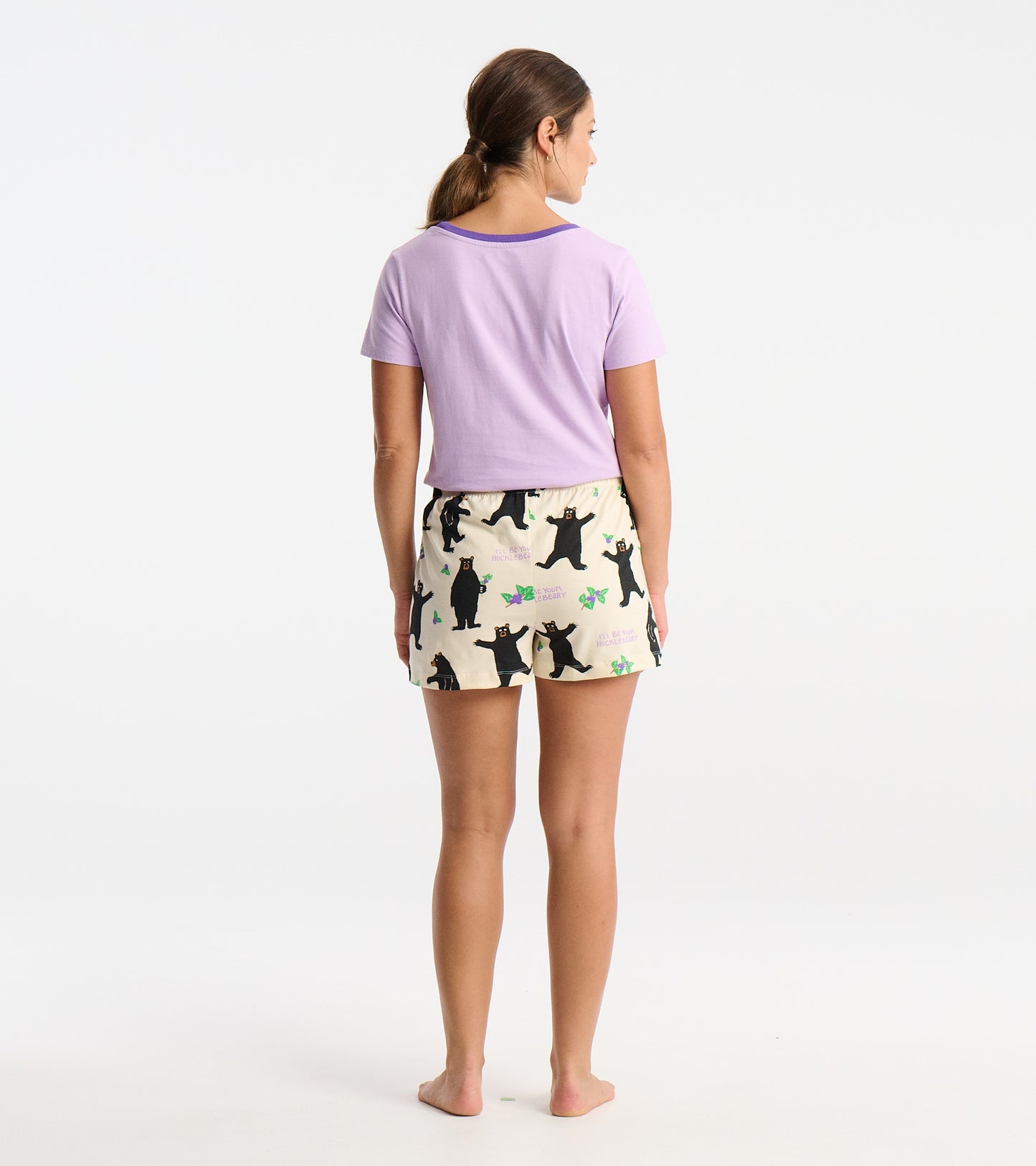 Women's cotton sleep shorts in cream with black bear print, featuring an elastic waistband and a relaxed fit.