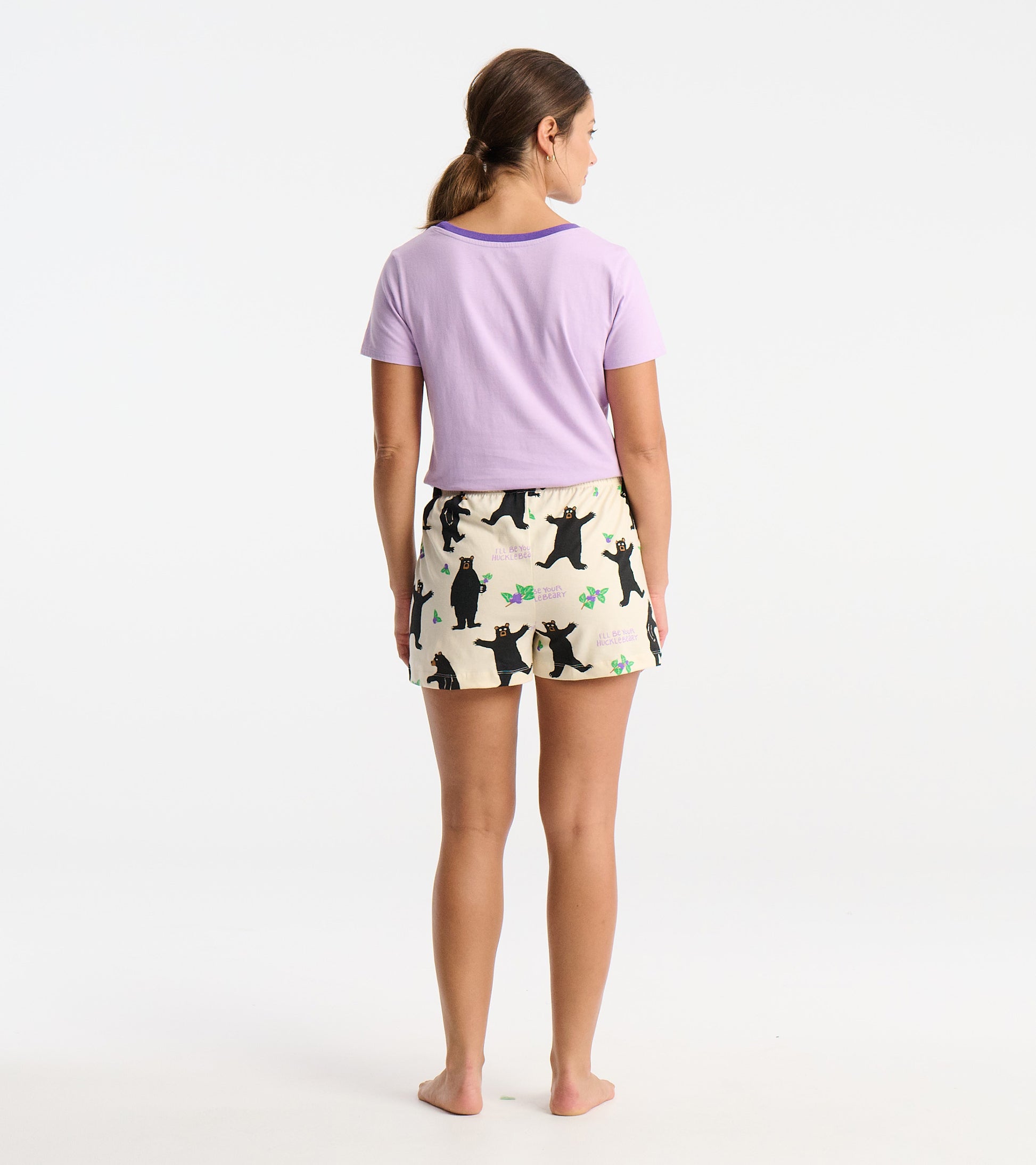 Women's cotton sleep shorts in cream with black bear print, featuring an elastic waistband and a relaxed fit.