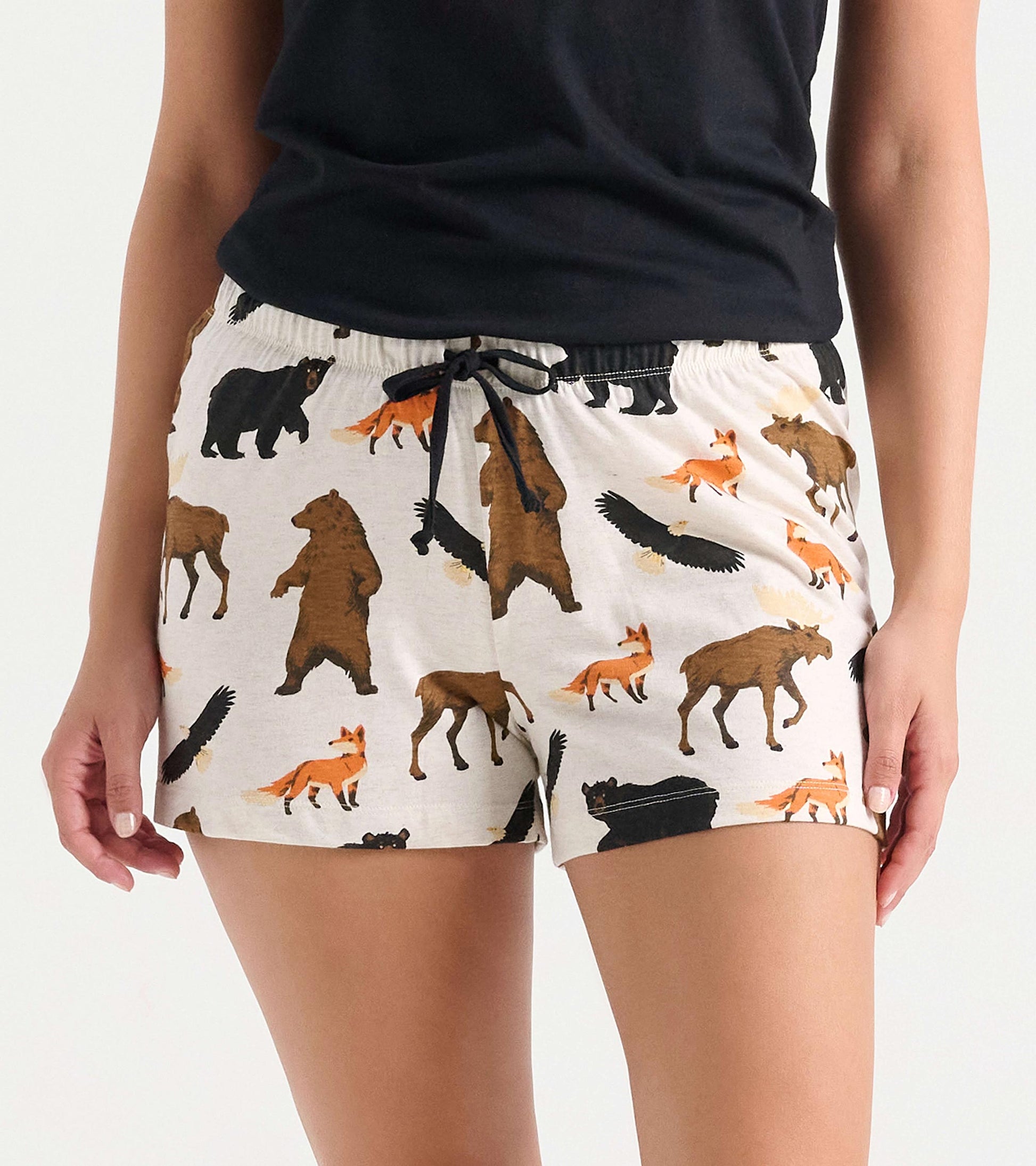 Cotton blend sleep shorts featuring a wildlife print with bears, foxes, and moose, designed for comfort and relaxation.