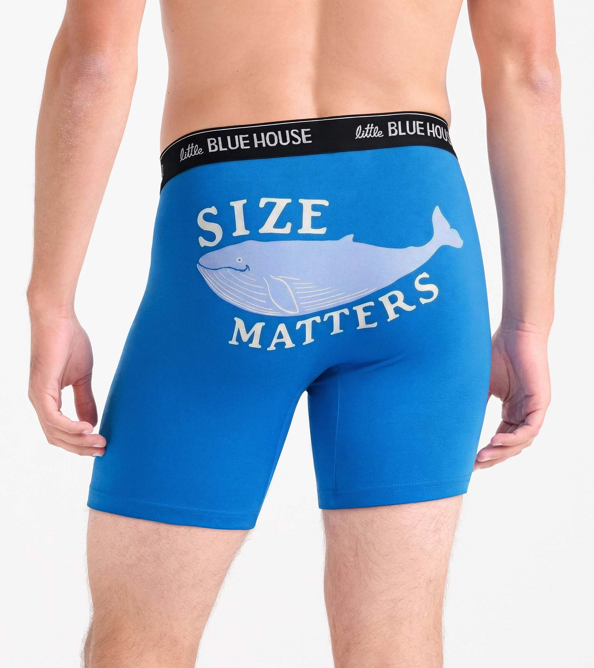 Blue boxer briefs with black waistband and whale graphic reading “Size Matters” on back view