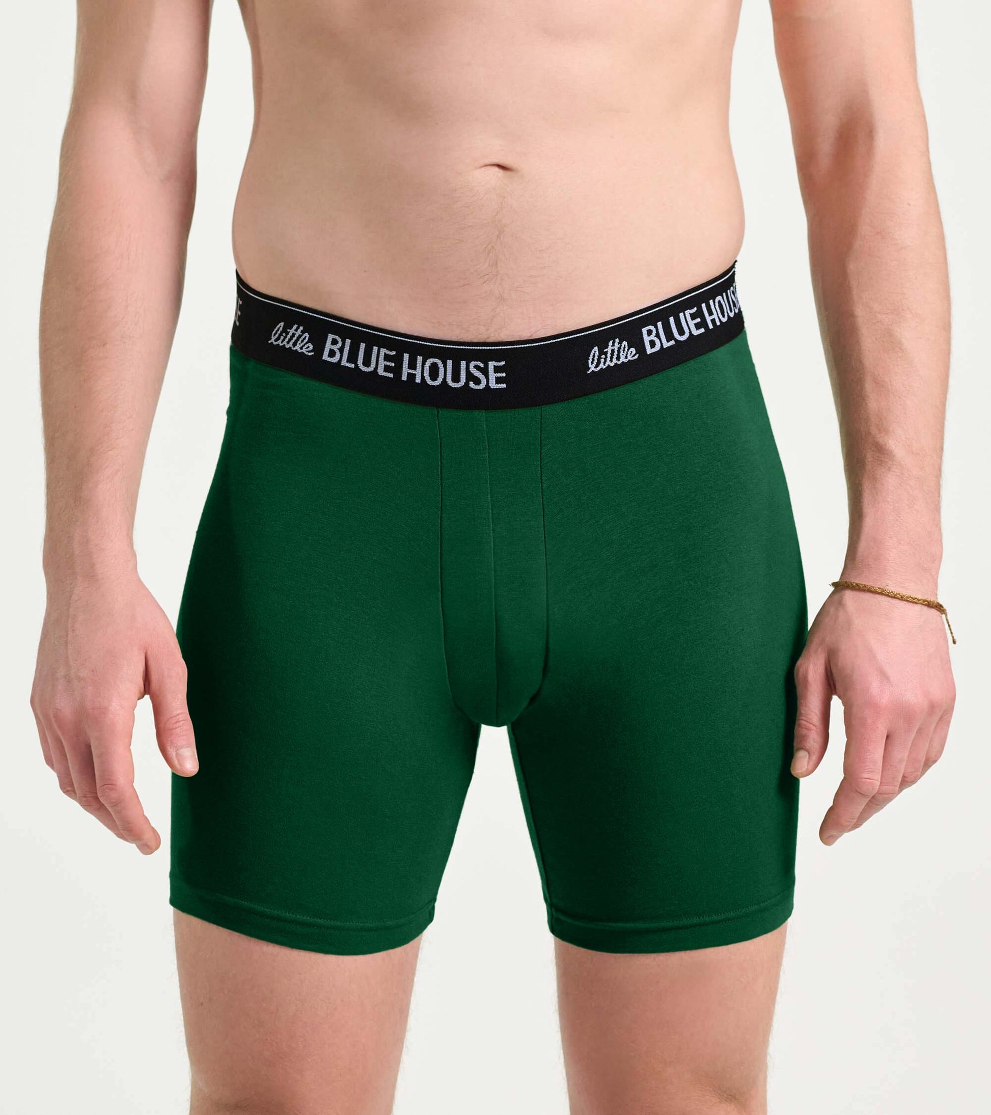 Green men’s boxer briefs with black logo waistband, front view
