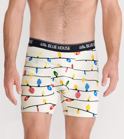 Men's boxer briefs featuring a festive pattern of colorful Christmas lights on a cream background.