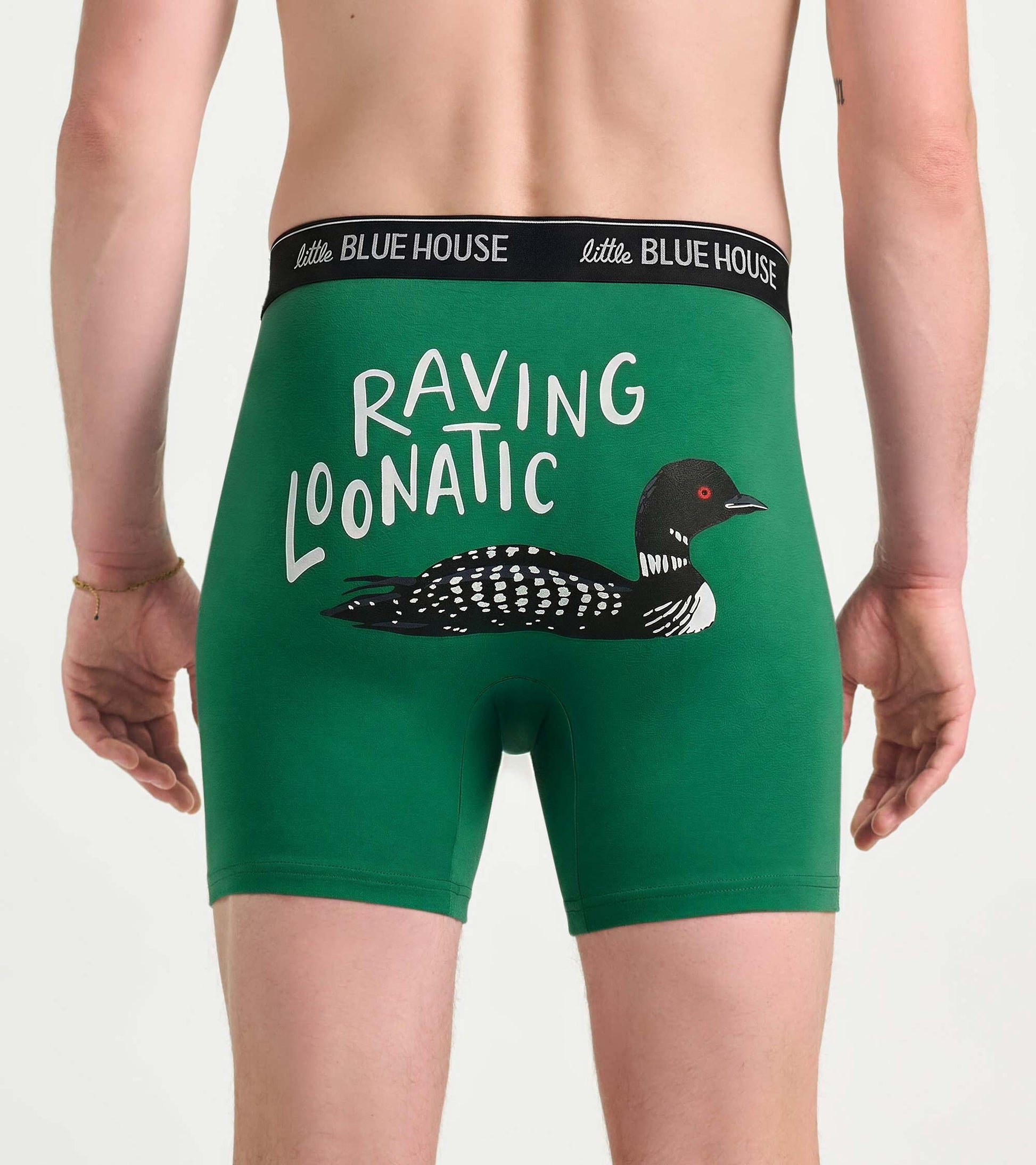 Back view of green boxer briefs with black waistband and loon graphic with “RAVING LOONATIC” text.