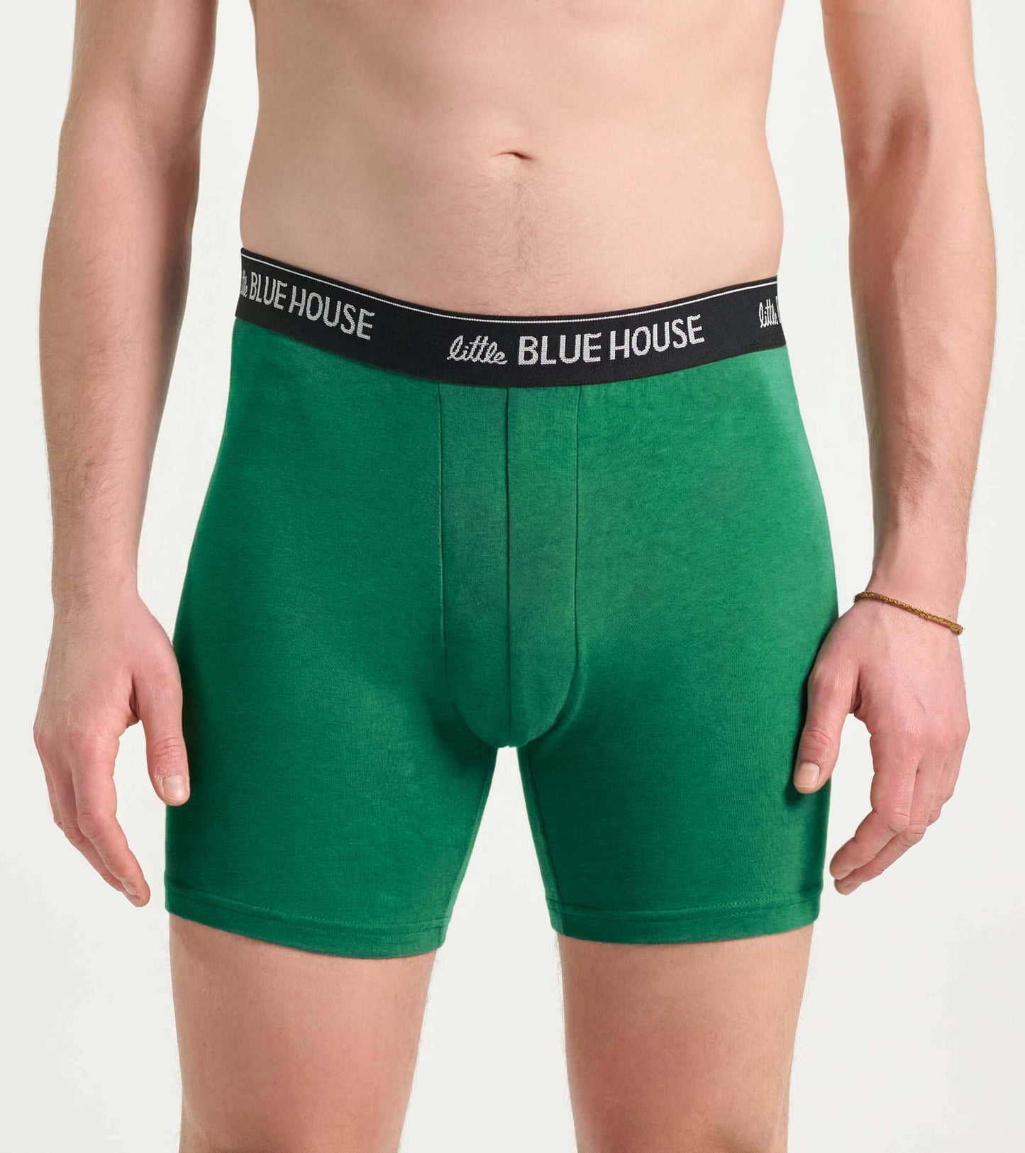 Green men's boxer briefs with black logo waistband, front view