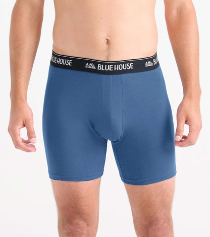 Blue men's boxer briefs with black logo waistband, front view