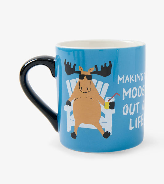 Blue ceramic mug with black handle, moose graphic, and white text on front view
