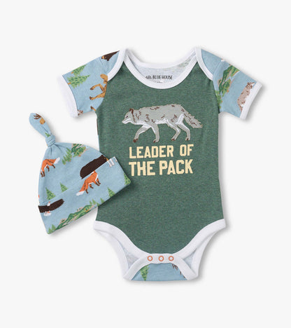 Green baby bodysuit with wolf graphic and “Leader of the Pack” text, plus matching fox-print hat
