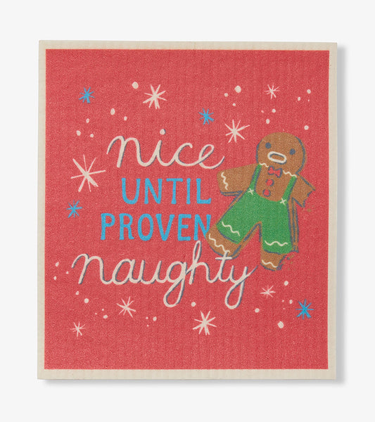 Red dishcloth with 'Nice Until Proven Naughty' text, starbursts, and a gingerbread figure in green shorts
