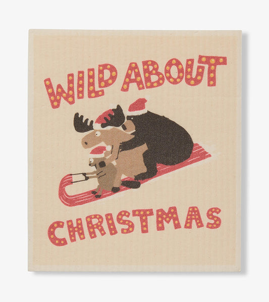 Eco dishcloth with 'Wild About Christmas' text and bear, moose, and squirrel in Santa hats on a red sled