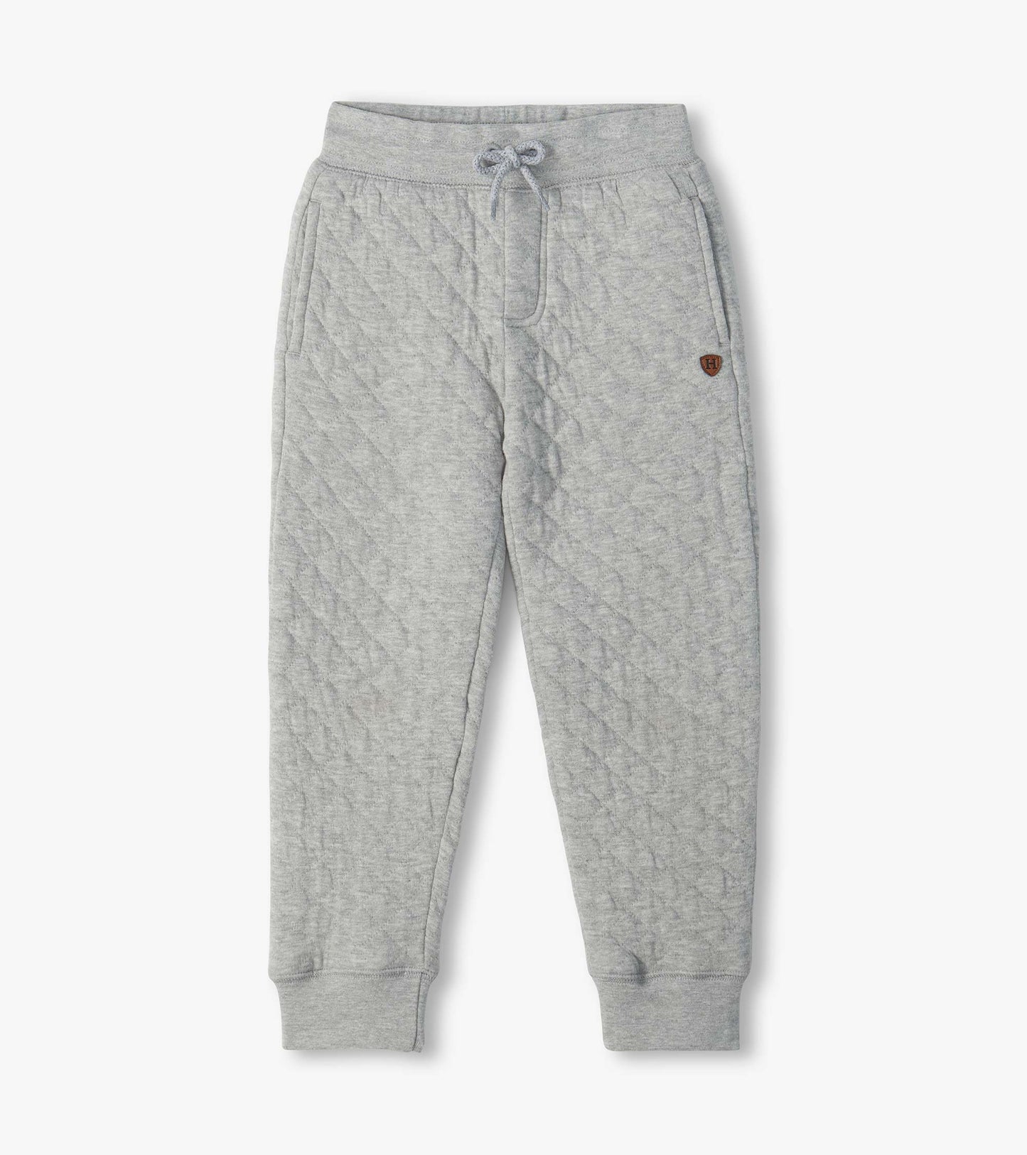 Grey quilted jogger pants with drawstring waist, side pockets, tapered legs, and ribbed cuffs