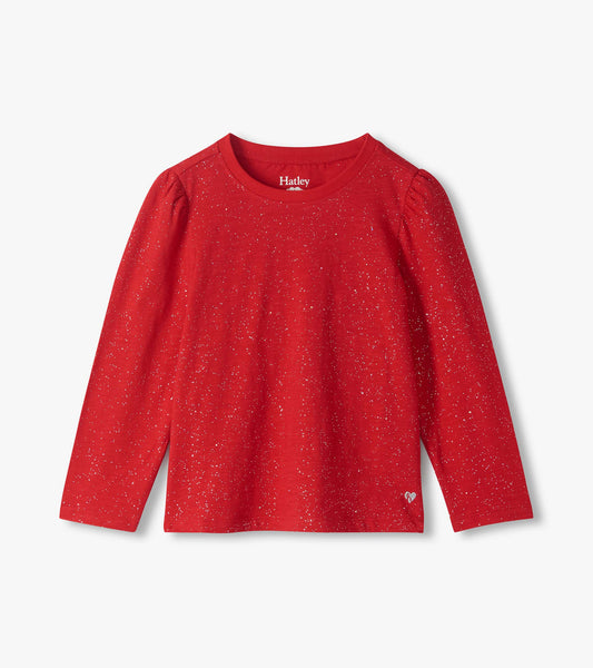 Front view of red long sleeve tee with silver speckled pattern, puff shoulders, and small heart near hem