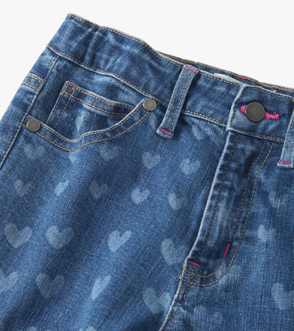 Flared leg denim in blue with a heart pattern, featuring a button closure and front pockets.