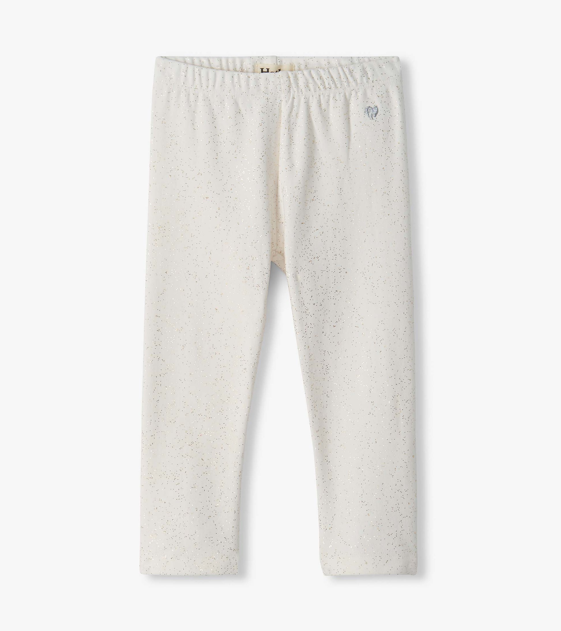 Infant cream leggings with an elastic waistband and scattered metallic speckles
