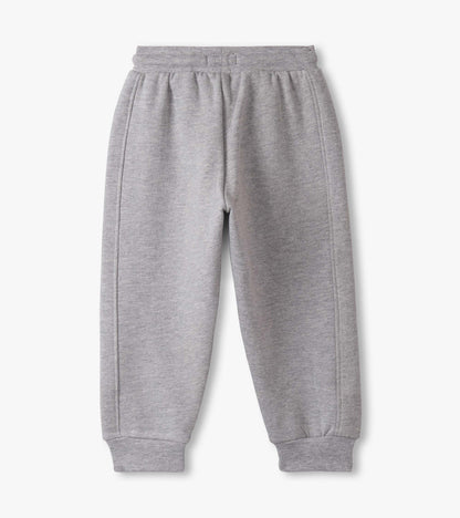 Grey athletic track pants for baby and toddler boys, featuring an elastic waistband and cuffed ankles.