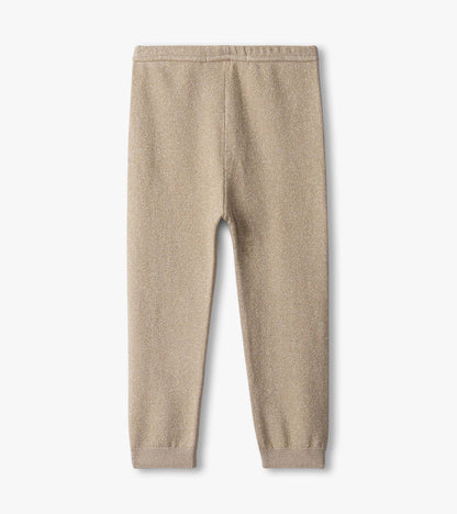 Gold glitter leggings for baby girls, featuring a soft, stretchy fabric and elastic waistband.