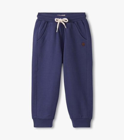 Patriot blue track pants for baby and toddler boys, featuring an elastic waistband and side pockets.
