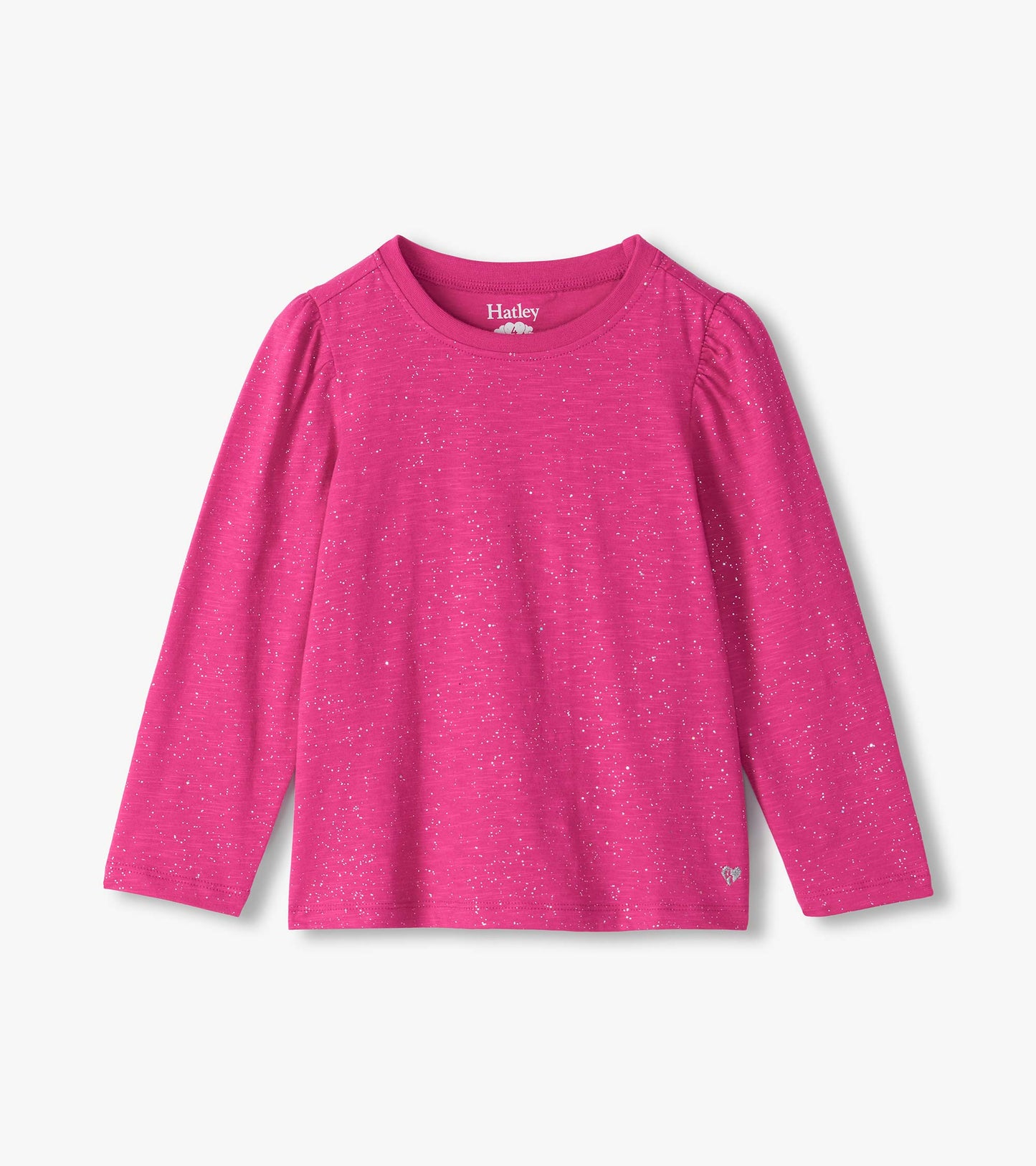 Bright pink long sleeve tee with silver speckles, puff shoulders, and a small heart detail at the hem