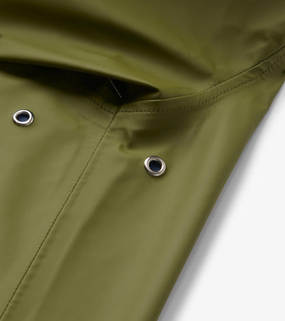 Close-up of loden green rain jacket hood with silver eyelets and stitched seam detail