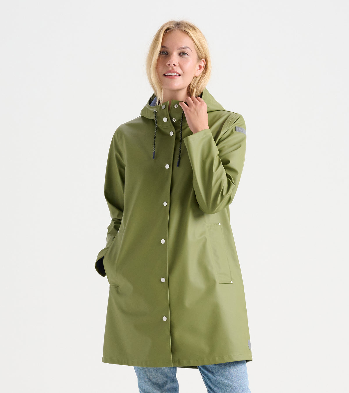 Women's loden green rain jacket, front view with hood, snap closure, drawcords, and front pockets