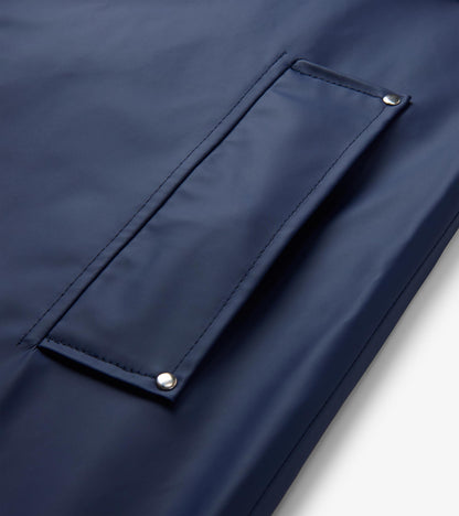 Close-up of patriot blue rain jacket front pocket with silver rivets