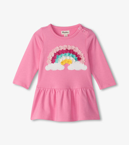 Pink long-sleeve toddler dress with rainbow cloud floral graphic and gathered skirt, front view