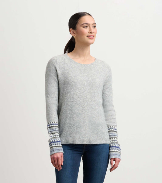 Grey melange sweater with patterned cuffs, featuring a round neckline and long sleeves, styled with blue and white stripes.