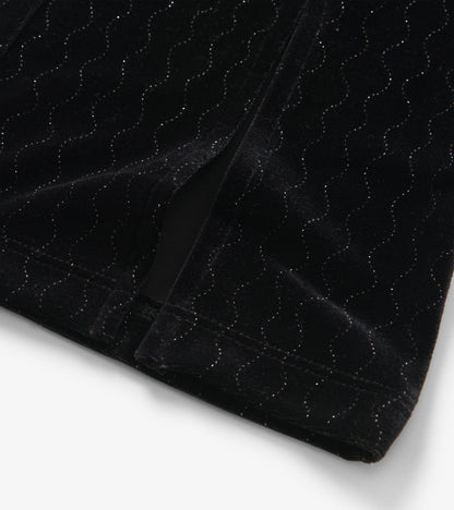 Black velour flared pants featuring a wavy pattern with subtle sparkle, ideal for casual or dressy occasions.