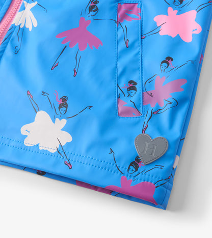Bright blue rain jacket featuring colorful ballet dancer prints and a heart-shaped logo patch. Zip-up design.