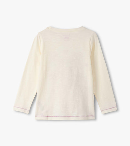 Cream long sleeve tee with a relaxed fit and purple stitching details, featuring a simple back design.