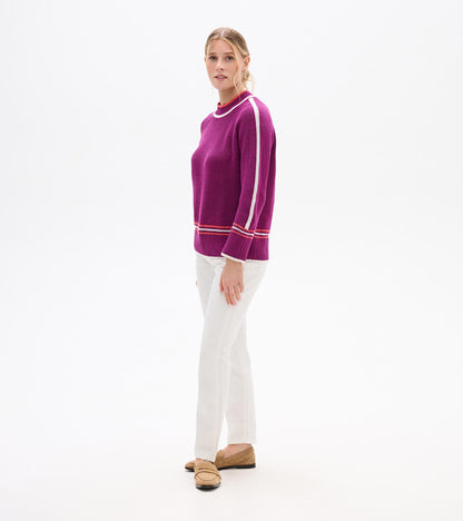 Crushed grape pullover with white and red stripes, featuring a relaxed fit and ribbed cuffs, worn with white pants.