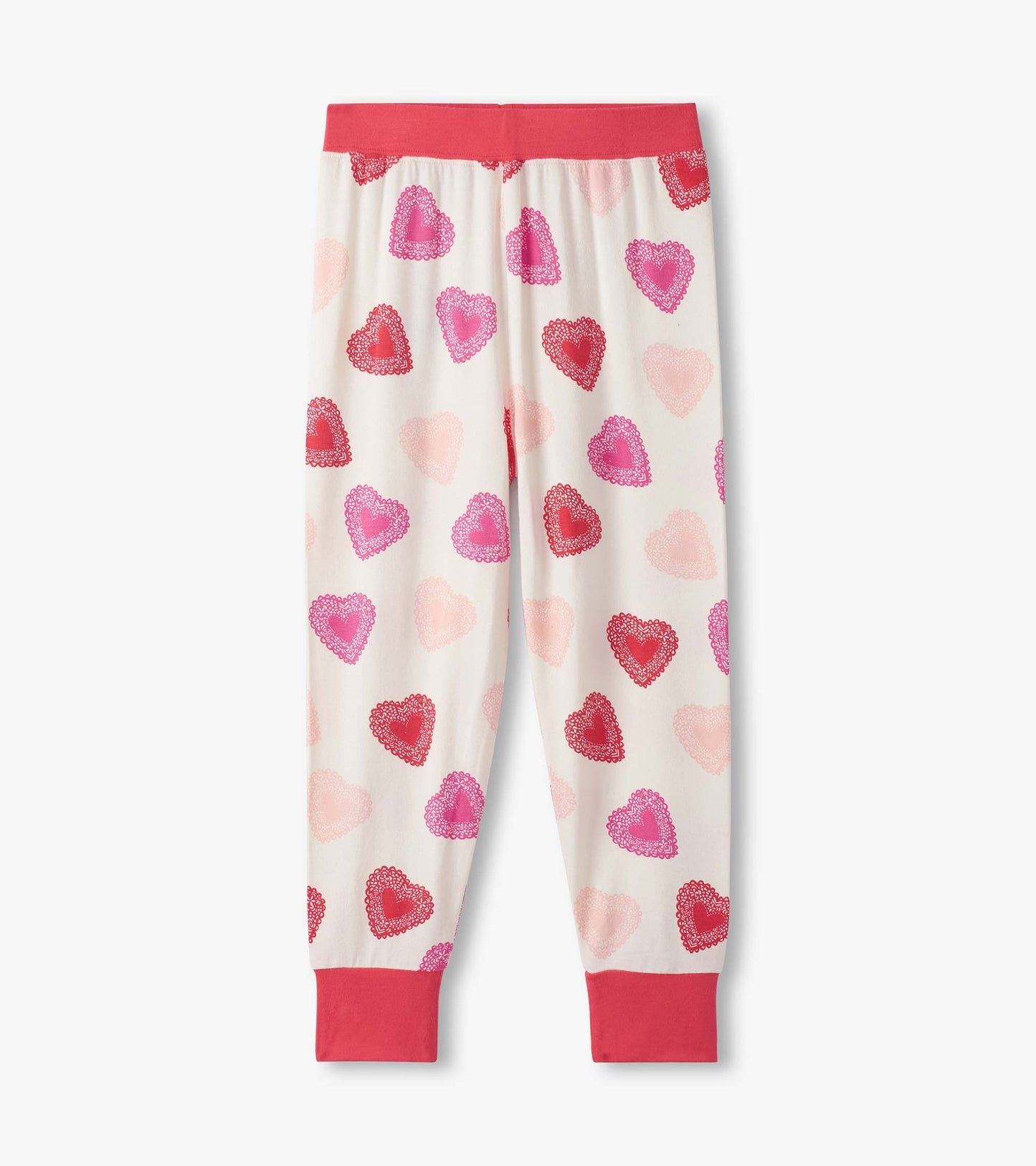 Bamboo pajama pants featuring a playful heart pattern in shades of pink and red, with a solid coral waistband and cuffs.