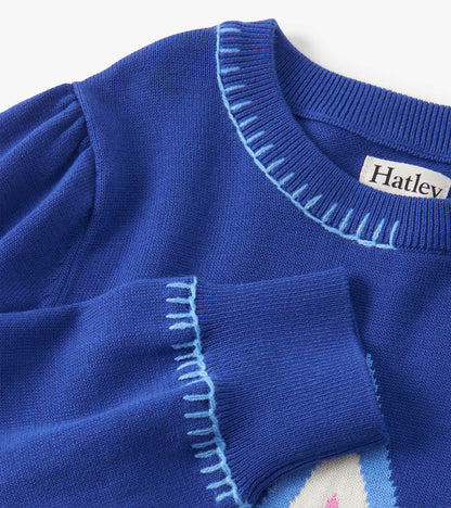 Blue pullover sweater with a ribbed neckline and decorative stitching, featuring a soft knit texture.