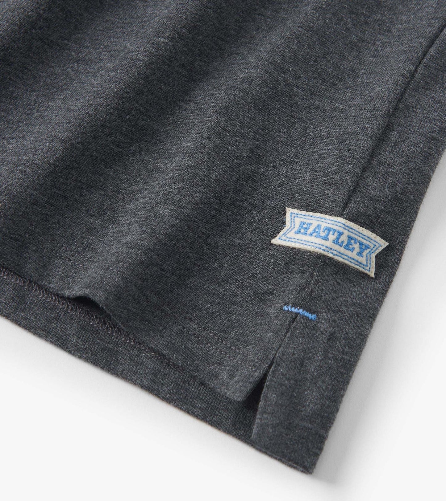 Blue and grey colour block long sleeve polo shirt with a side slit and a label on the hem.