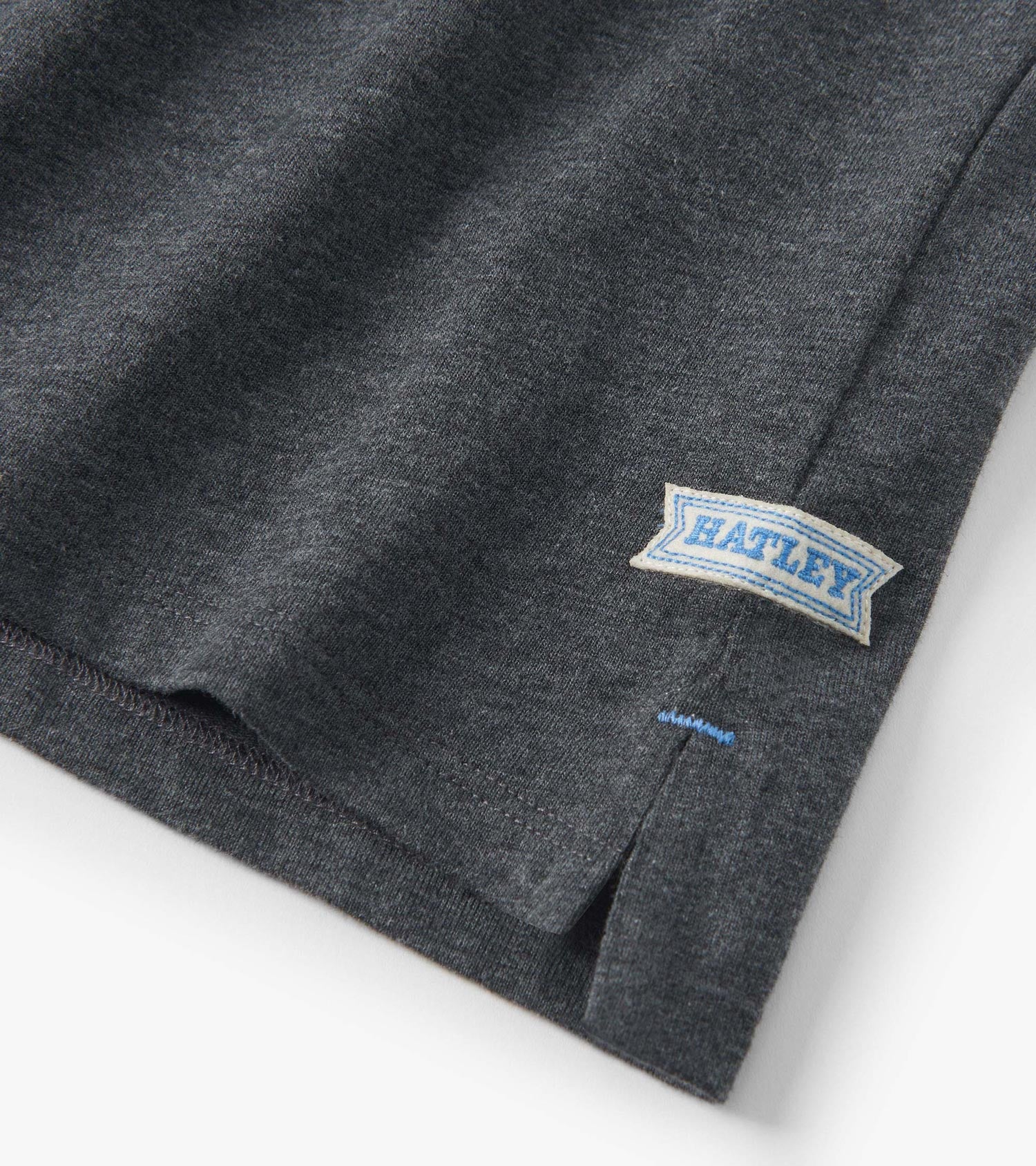 Blue and grey colour block long sleeve polo shirt with a side slit and a label on the hem.