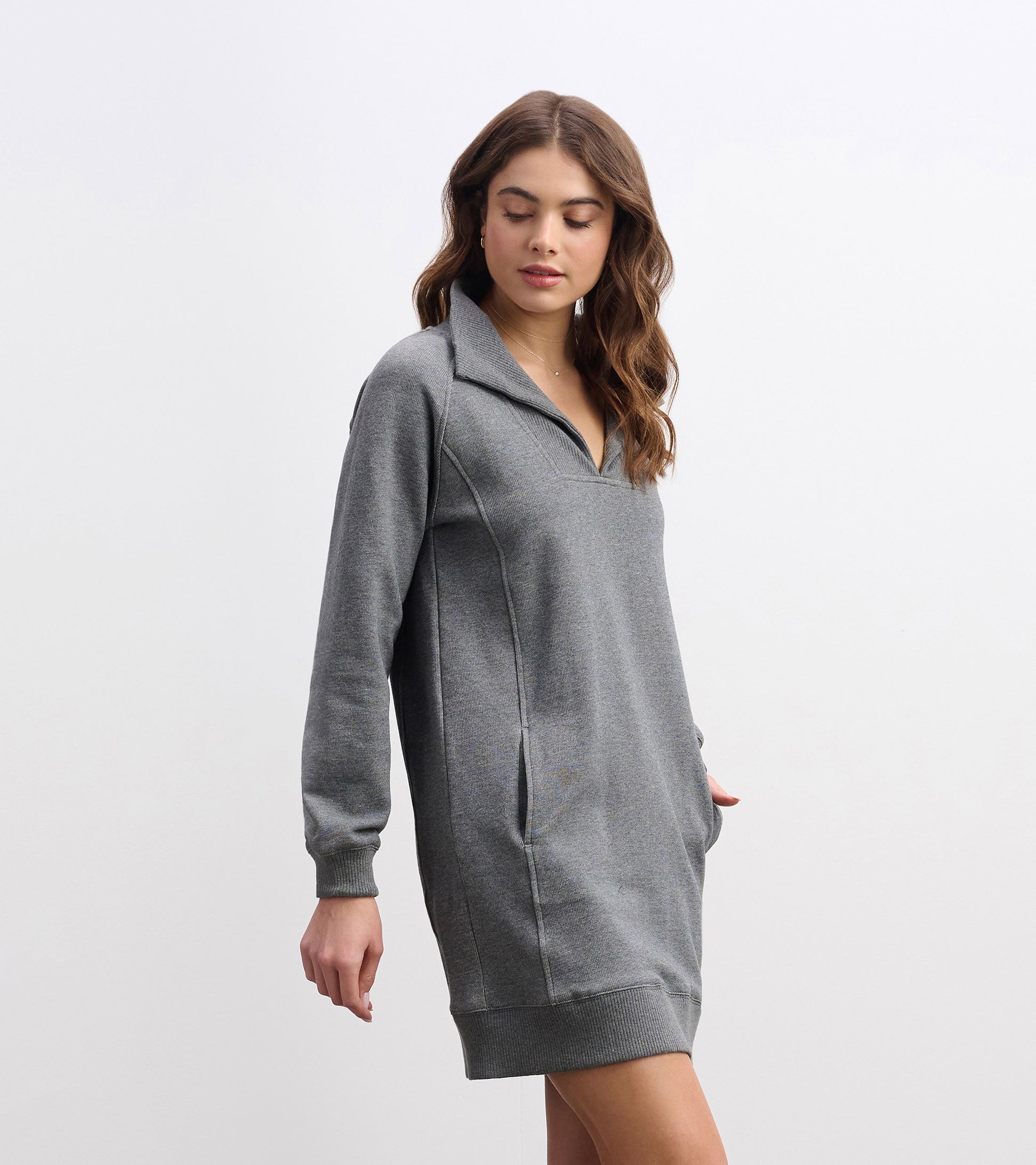 Charcoal melange dress with a notch neck, long sleeves, and side pockets, featuring a relaxed fit.