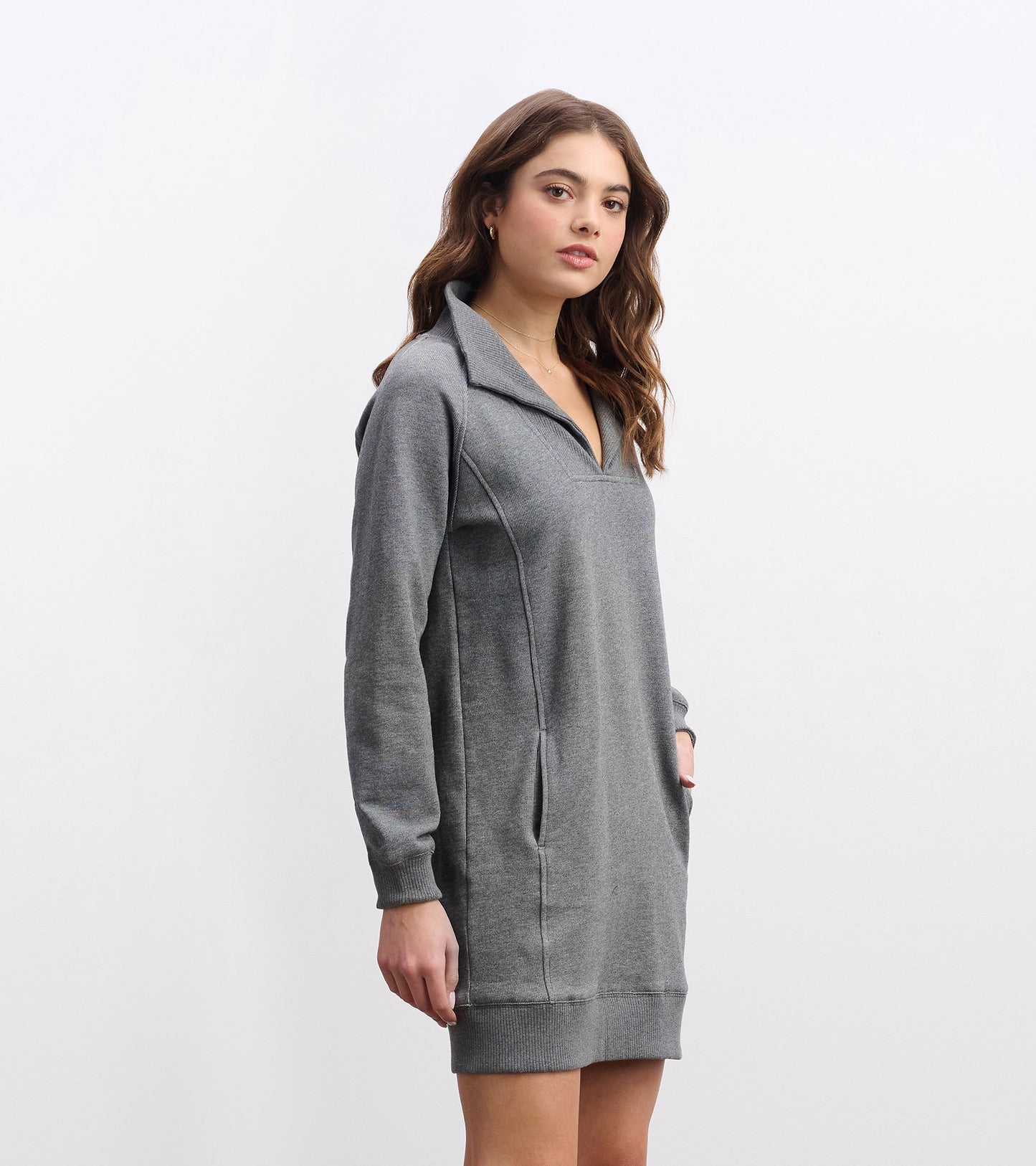 Charcoal melange dress with a notch neck, long sleeves, and side pockets, featuring a relaxed fit and soft material.