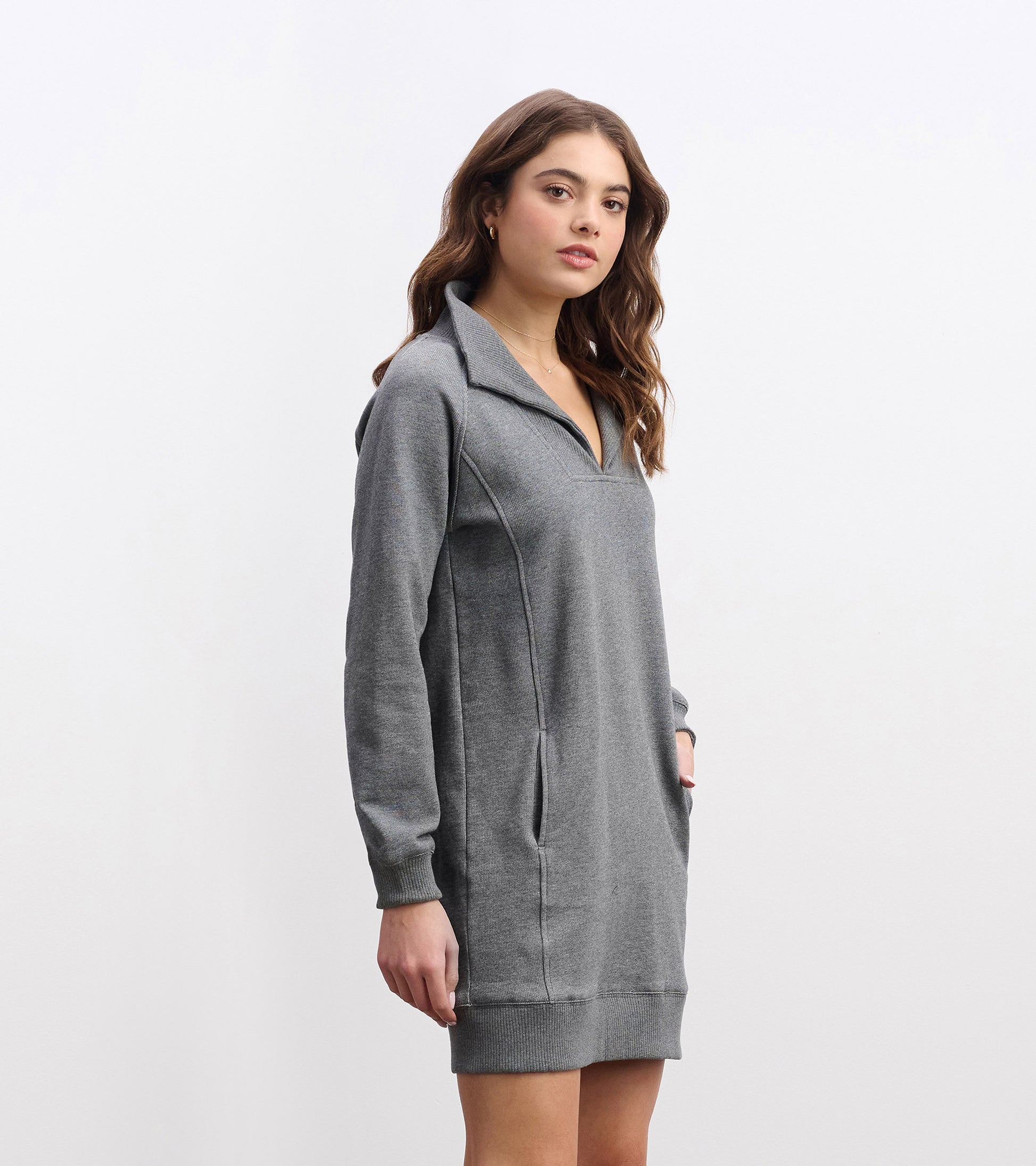 Charcoal melange dress with a notch neck, long sleeves, and side pockets, featuring a relaxed fit and soft material.