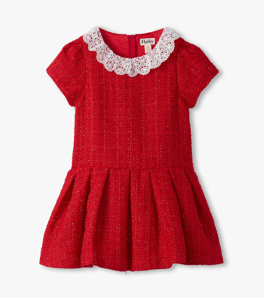 Red boucle dress with short sleeves, pleated skirt, and a white lace collar.